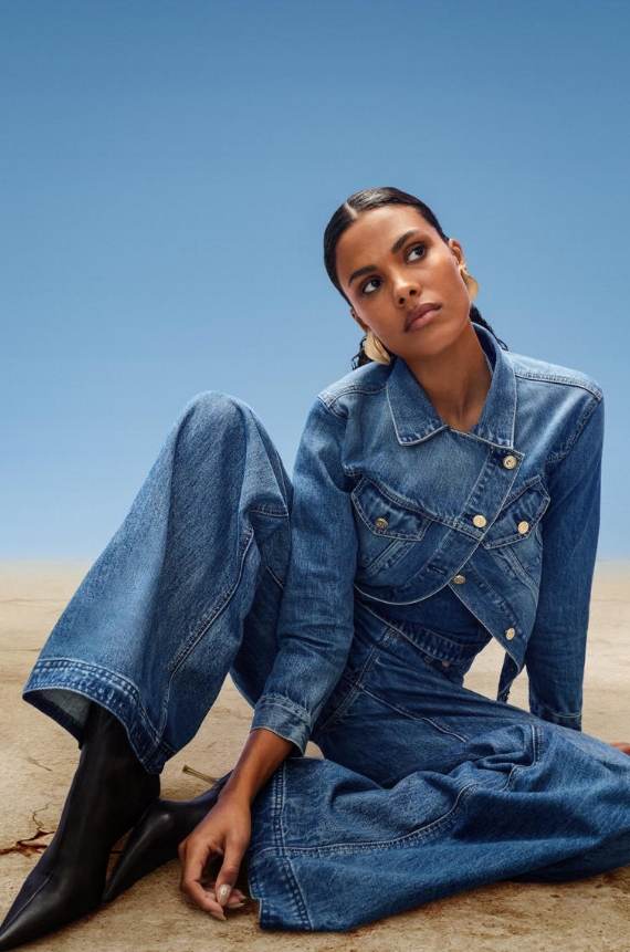 a woman in a denim suit